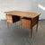 A rare Danish desk by Gunnar Nielsen, made in quarter-sawn oak with a substantial floating top raised above the frame on...