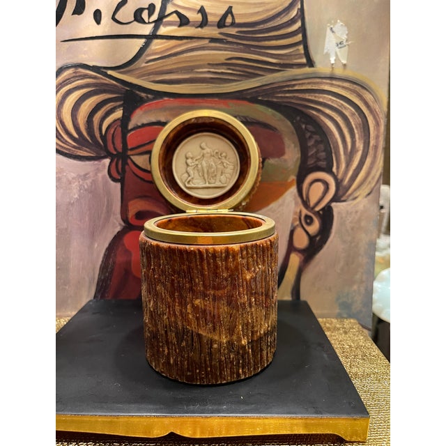 Lovely Vintage fluted cache jar carved/ fluted column design. Lid opens up to reveal a lovely intaglio like piece affixed...