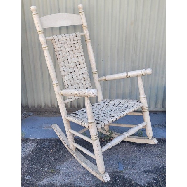 This folky 19thc original oyster painted rocking chair is in fine as found condition.It has all original slatted seat and...