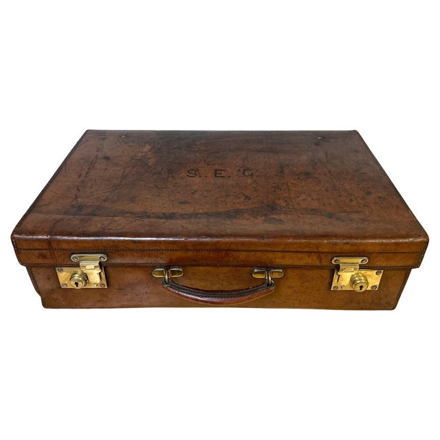 Edwardian English Leather & Brass Suitcase by Army & Navy CSL, London, Early 20th Century Description: A handsome and...