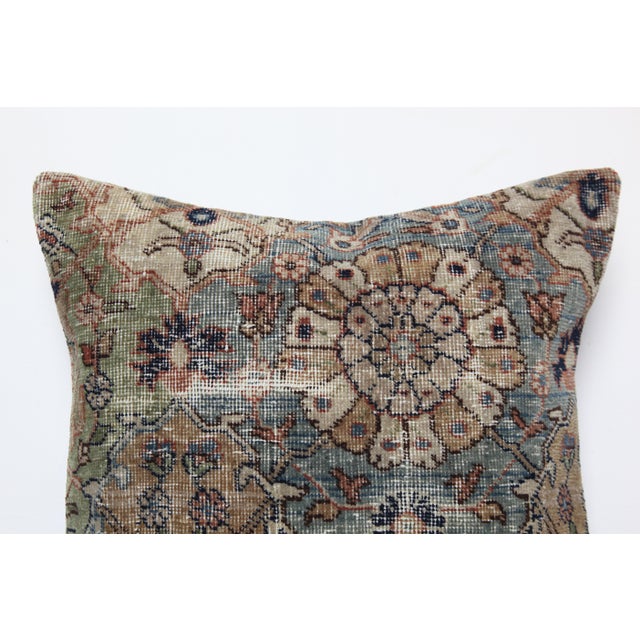 This striking pillow cover is crafted from a vintage hand-knotted tribal rug, bringing authentic Old World character into...
