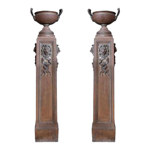 Mid 19th Century Pair of Cast Iron Pedestals With Urns and Lion Detail