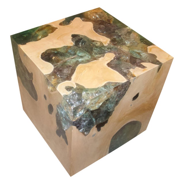 The St. Barts side table is a unique variation of the teak and cracked resin cube. Ice blue or aqua resin is first cracked...