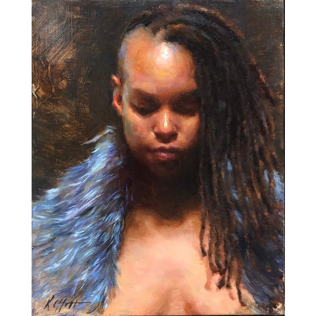 This oil on board piece captures a contemplative figure with a serene expression, their head bowed slightly as though lost...