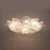 This large and elegant italian ceiling light features murano glass leaves arranged in a rich floral composition. Each...