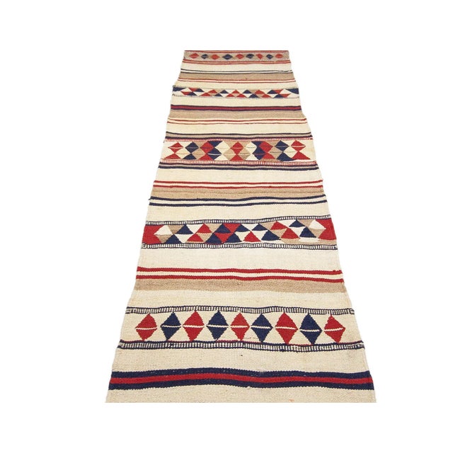 Vintage handwoven decorative kilim runner from Northern Iraq. Approximately 40-50 years old. In very good condition.