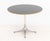 George Nelson for Herman Miller Pedestal Table, black veneered maple top above aluminum base, partial Herman Miller label...