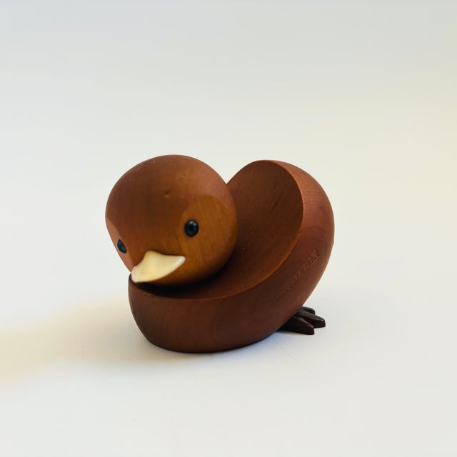 A mid century turned wood figurine in the shape of a Mandarin Duck. Adorable stylized features. Made in Japan by Senshukai...