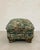 Late 20th-century vintage ottoman on carved hardwood bracket feet. Features a dense verdure tapestry weave in the style of...