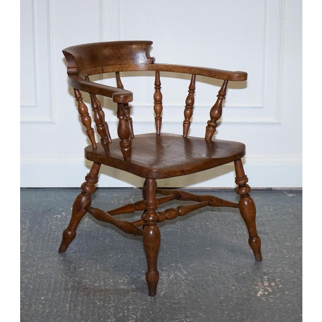 Gorgeous Elm Smokers Captains Armchair. This Edwardian solid elm bow back smokers captain's chair is truly stunning, with...
