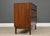 A mid century modern walnut dresser with rosewood drawer pull accents designed by Kipp Stewart for Directional by Calvin....