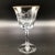 Fostoria water goblets have an etched floral pattern with a gold rim and fluted stem.