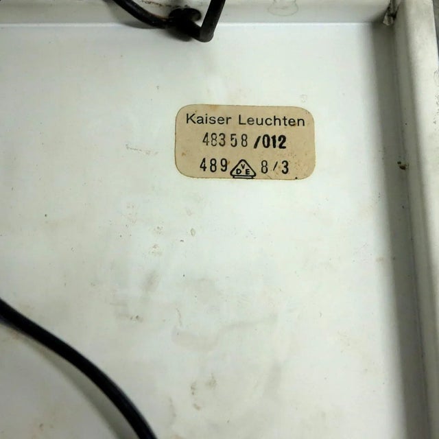 This pair of wall lamps was made in the 1960s in Germany by Kaiser Leuchten. They each feature glass tubes that are...