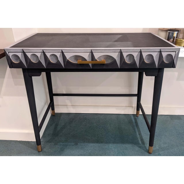 The De Chirico Console is a unique hand painted table with wide drawer. The top and legs are black and the feet are...