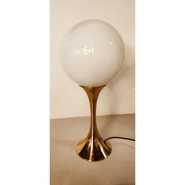Vintage Brass Light with Sphere Glass, in Very Good conditions. Designed 1970 to 1979 European Plug (up to 250V).The...
