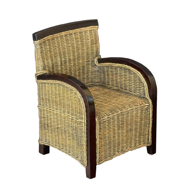 A fine French child's lounge chair or armchair featuring a solid wood frame with hand-braided rattan or seagrass panels....