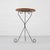 Charming French side table from the 1960s/70s with a slender wrought iron base and round wooden top. The black-finished...