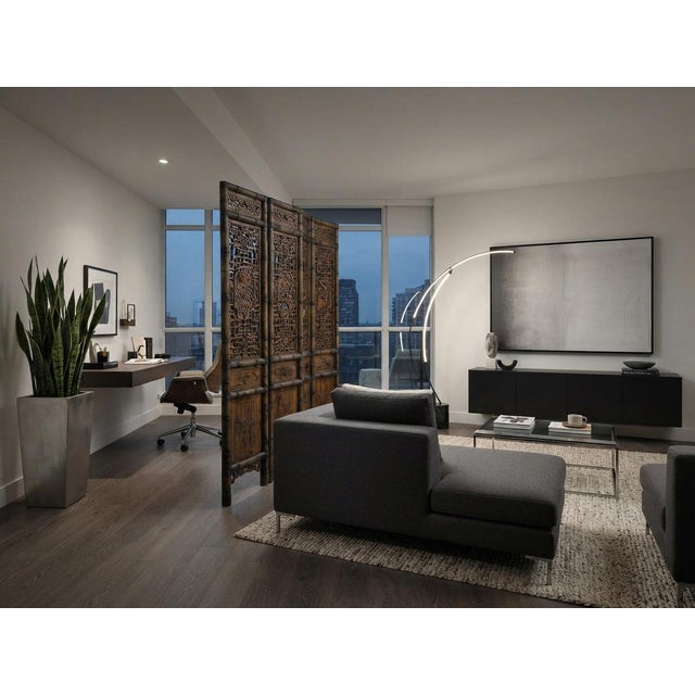 Elevate your interior space with this magnificent vintage four-panel room divider, masterfully crafted from natural wood...