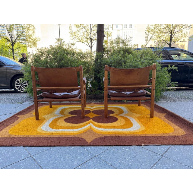 Two absolute collector's items: these two Sirocco Safari chairs, designed in 1964 by Arne Norell for Norell Möbel AB. The...