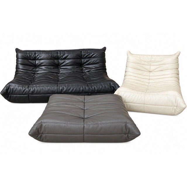 Michel Ducaroy Togo, Three-Piece Leather Set Ligne Roset, France. Set includes 3 seater sofa, chair and ottoman. All...