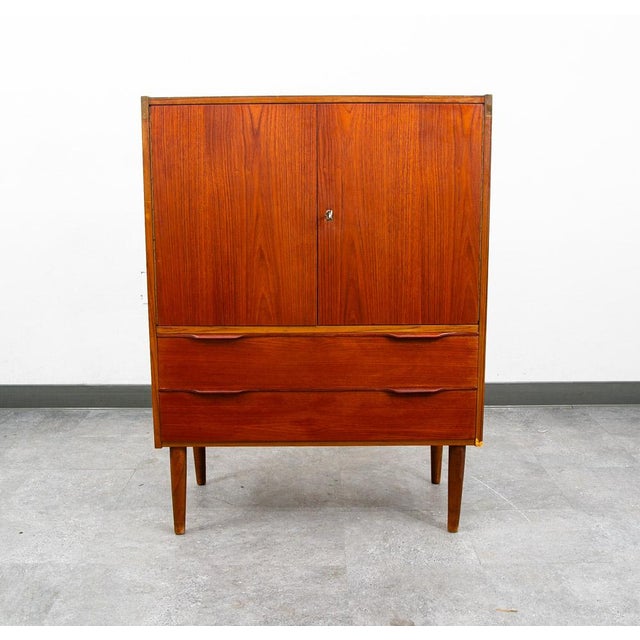 Danish modern cabinet in teak recently imported from Denmark in our latest shipment. Comes with adjustable storage shelves...