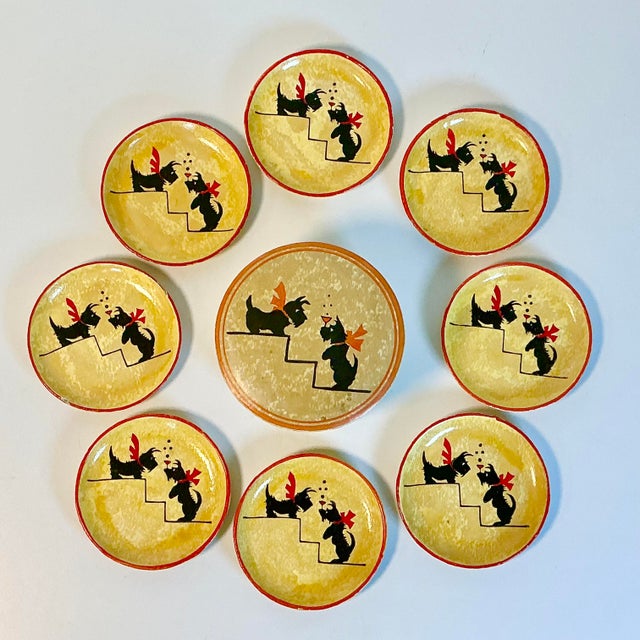 This is a set of 8 coasters with a matching round box for storage. They are from the 1950s by Jerywil Products out of...
