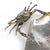A Silver Plated Bronze Sculpture of a Crab. The crab is depicted holding a polished abalone shell, often used as a serving...
