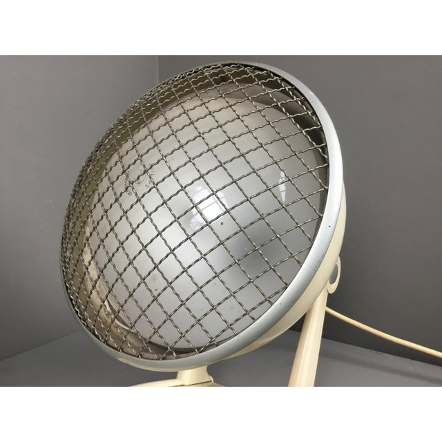 Great industrial design from the Netherlands. This metal lamp was used to give warmth and features bakelite details. It is...