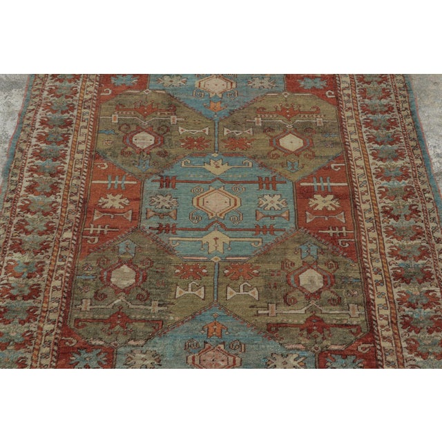 Hand-knotted in wool and dating to circa 1910–1919, this 4x5 antique Turkish rug features geometric medallions, angular...