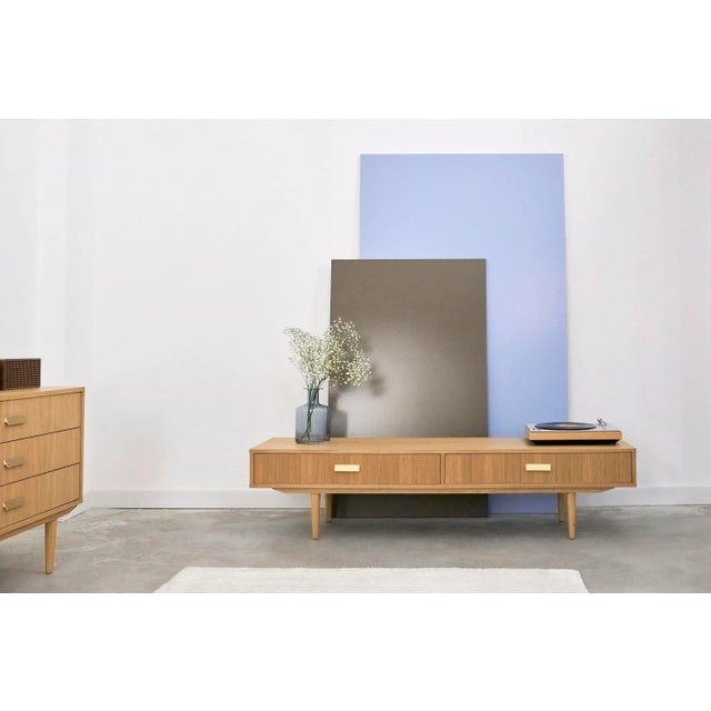 This stylish lowboard will perfectly fit into a home living room, a study for work, but also in a stylish office.The...