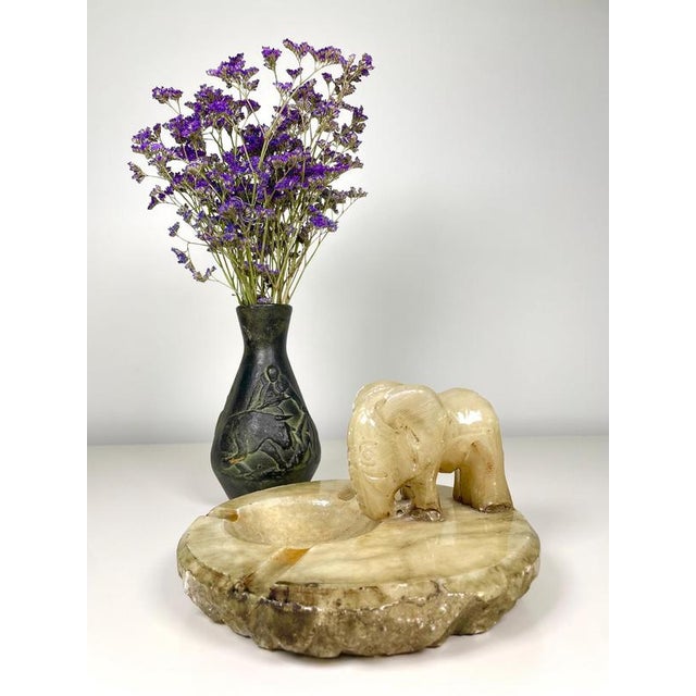 Add a touch of timeless charm to your space with this vintage alabaster ashtray, featuring a beautifully hand-carved...