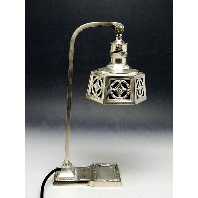 The desk light comes from the early 20th century. It is an Art Nouveau style lamp. It is kept in very good condition....