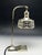 The desk light comes from the early 20th century. It is an Art Nouveau style lamp. It is kept in very good condition....