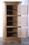 A striking 1960s Danish Mid-Century Modern light oak corner cabinet, in the style of Henning Kjærnulf, designed to...