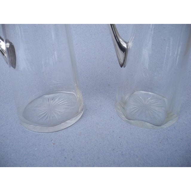 A very exclusive pair of Art Nouveau wine decanters with 800 silver mounts. Manufacturer and designer: Wilhelm Binder A...