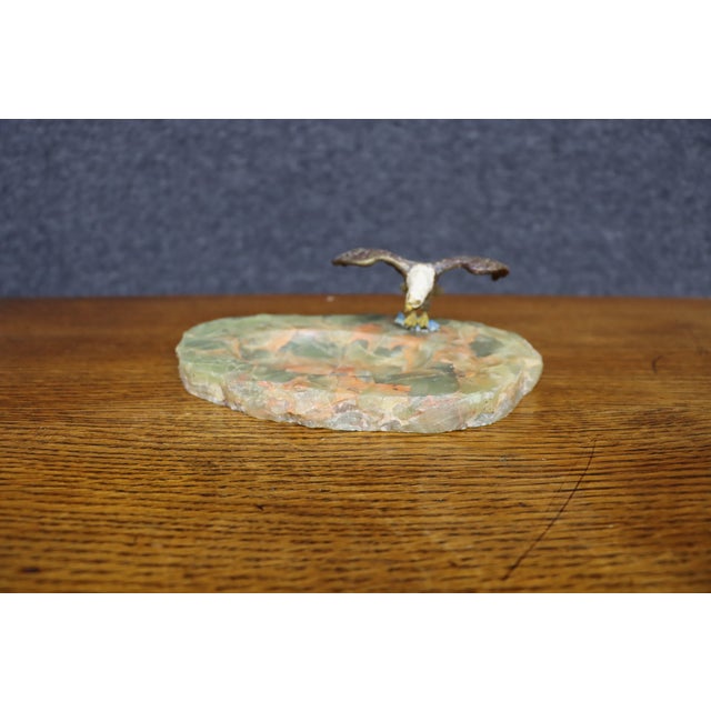 Striking antique bronze bald eagle with wings fully extended, mounted on a substantial polished green onyx base with...