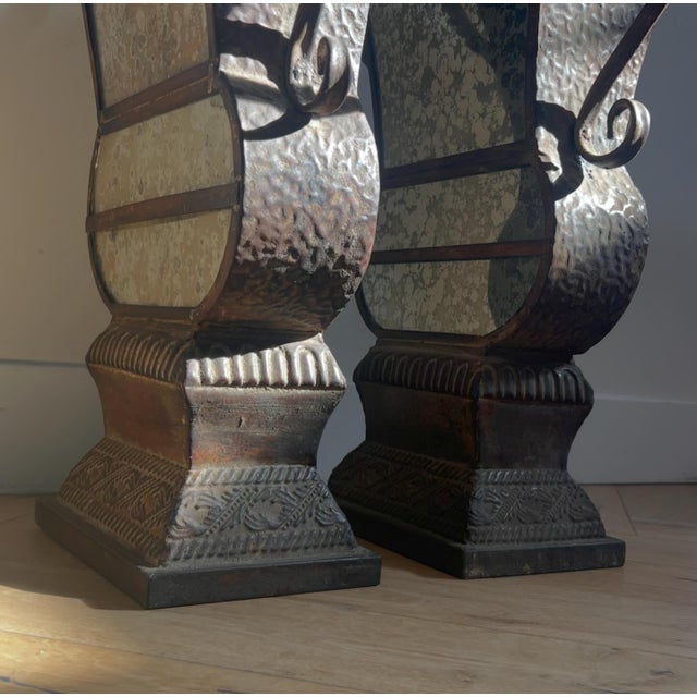 A pair of decorative metal and mirrored urns, 20th century. Good patina, not sure provenance - feels like Beaux Arts....