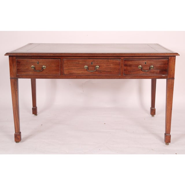 Antique George II style mahogany partners writing table, 19th century. With an inset tooled leather top, mahogany border,...