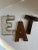 Three letters made from vintage wood, EAT. Perfect for your country or shabby chic kitchen. Loops to hang on the back....