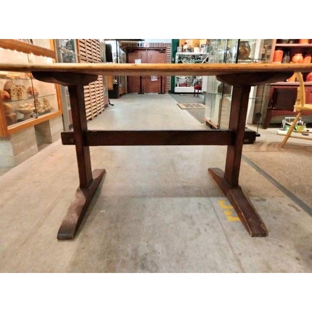 Early 20Thc hand crafted trestle table from Lancaster County,Pennsylvania.This table has a dark old wash on the base and...
