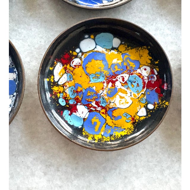 Wonderful collection of mid-century, modern coasters, copper with enamel painted design.