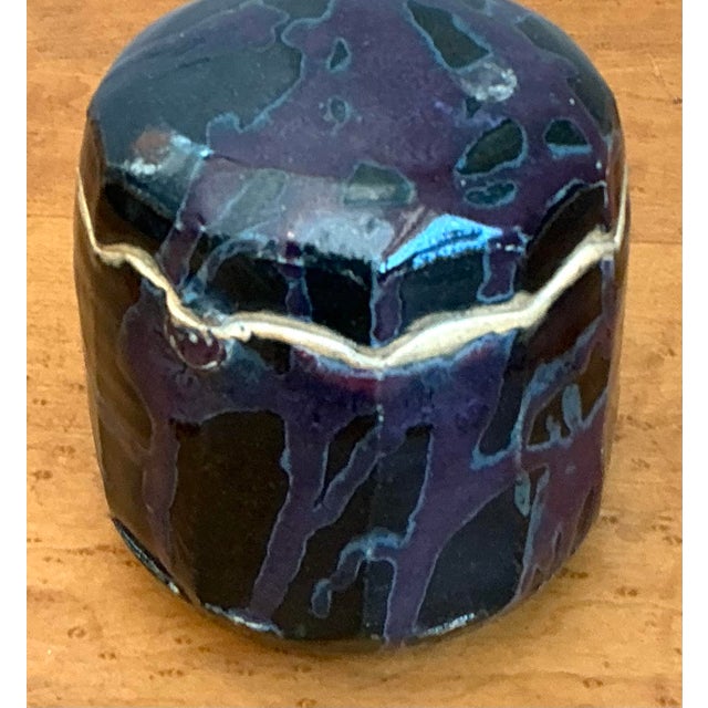This striking vintage lidded jar is a masterclass in mid-to-late century studio pottery, blending organic form with a...