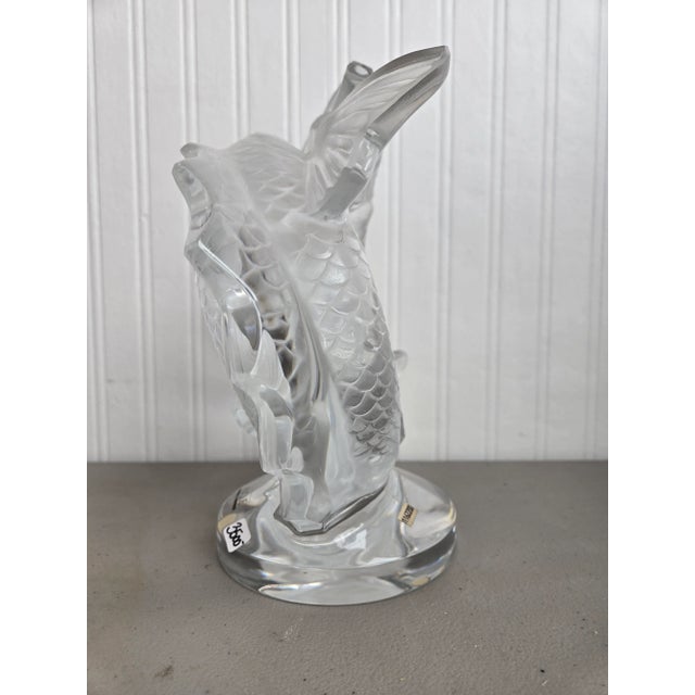 This stunning Lalique crystal sculpture, designed by Marc Lalique in 1953, features two elegant Koi fish gracefully...