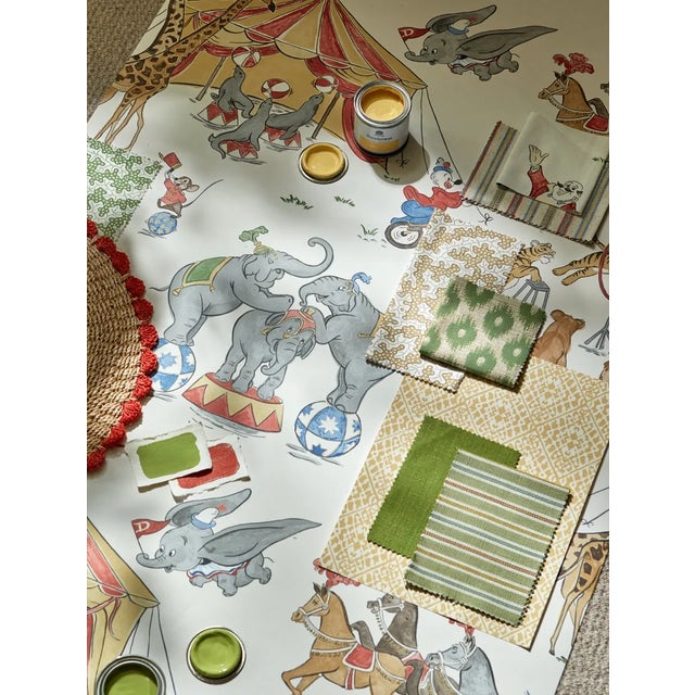 With its flag flying high head off to the big top with Disney`s Dumbo in this charismatic archive inspired wallpaper. A...