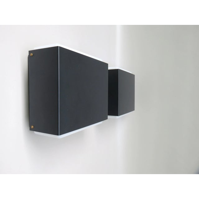 A few cubistic outdoor lights with screens from the 60s from Bega. Both lies wear the original manufacturer sticker Bega...