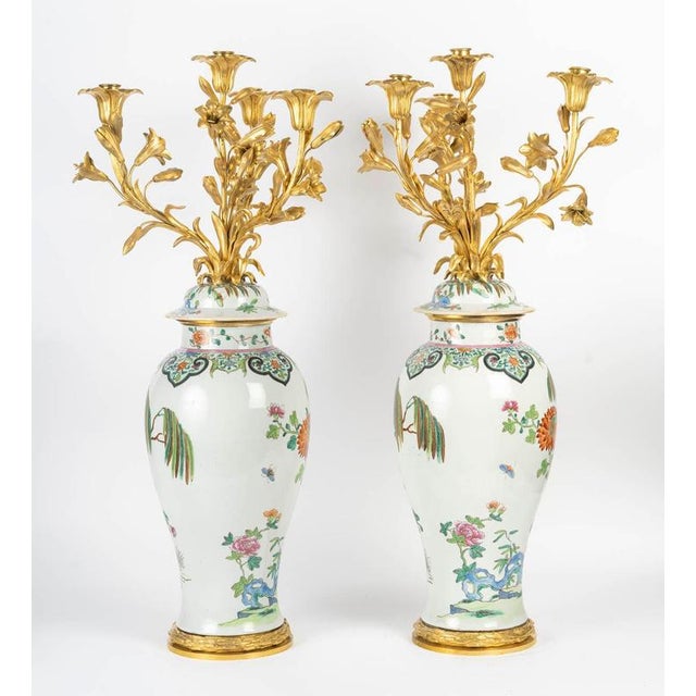 Pair of large porcelain and gilt bronze candelabras in the chinese style, 19th century. A pair of large 19th century...