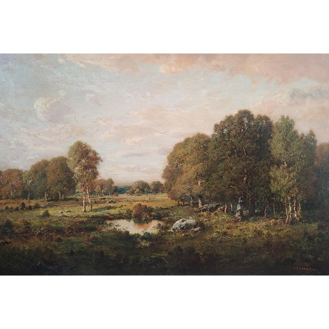 Original, late 19th century oil painting by Claude E. Picault depicting a bucolic landscape at sunset with a small pond at...