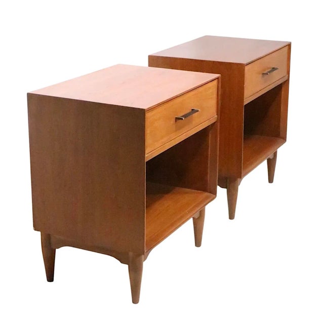 Chic pair of mid century nightstands by the Ramseur Furniture Company, circa 1950/60's. These night tables feature one...