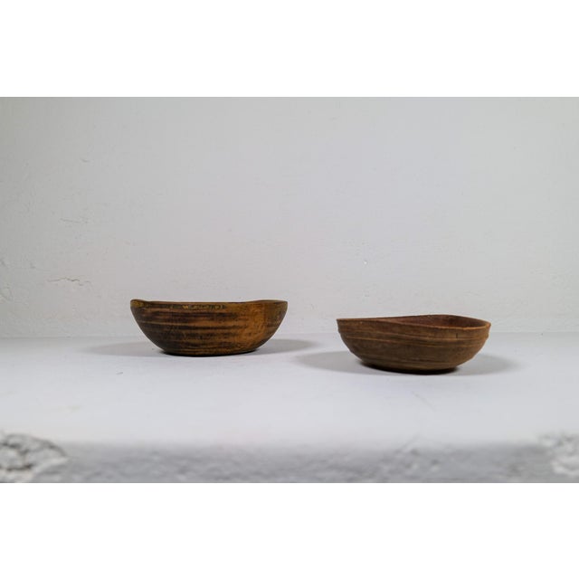 Set of two antique and unique organic wooden bowls. With highly appealing patina, with traces of use. Produced in sweden,...