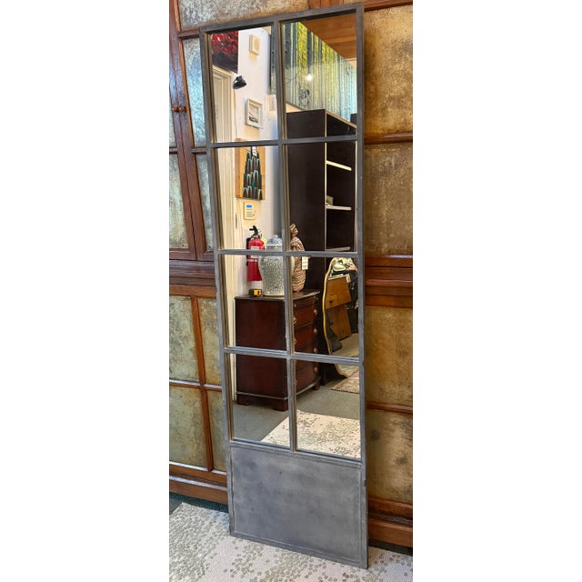 Design Plus Gallery presents a Full Length Mirror from Bid K Home. The Mirror has an eight rectangular windows arranged in...